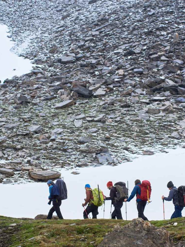 group-of-mountaineers-walking-along-rocky-hill-2023-11-27-05-19-41-utc (1)